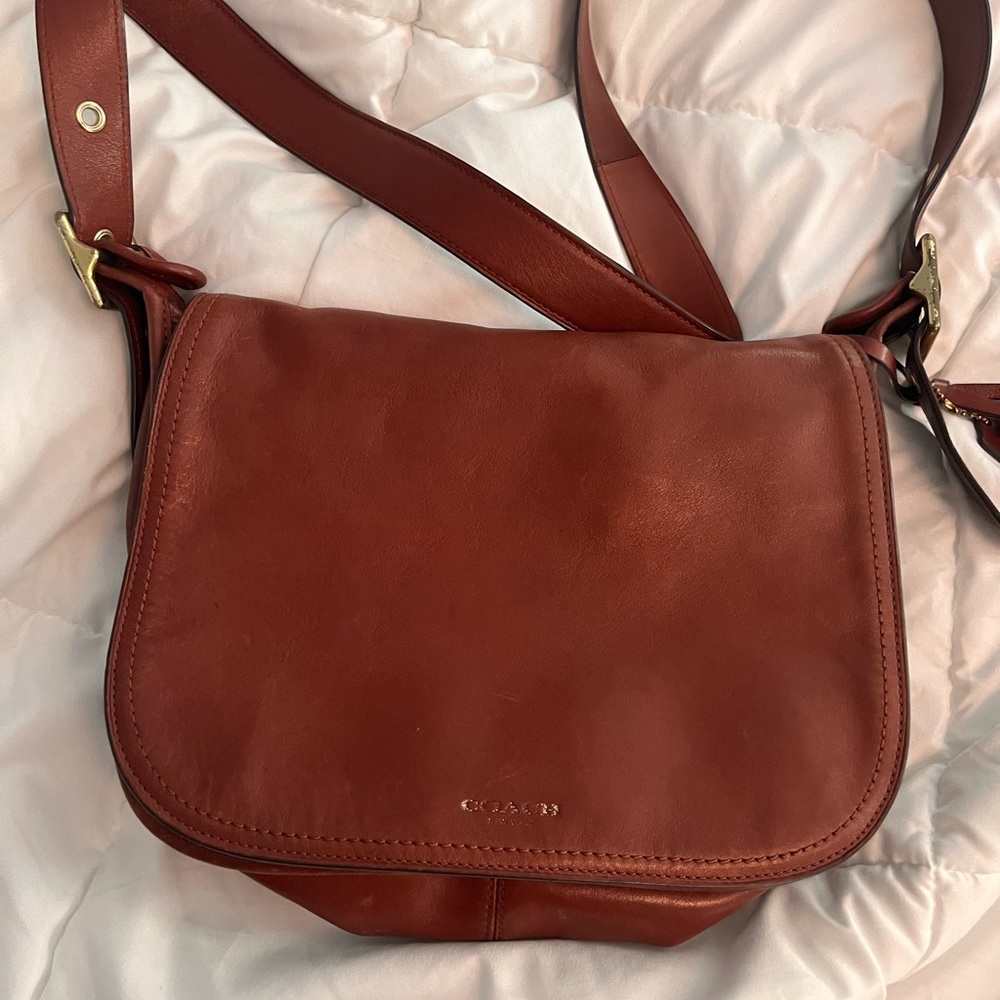 Coach saddle leather crossbody : handbag.  It’s the Patricia bag